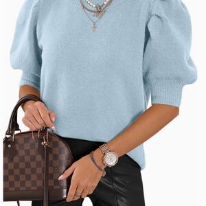 Women's Blue Sweater With Bubble Sleeve. 65% Rayon 30% Polyester 5% Spandex.